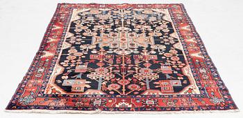 A oriental rug, c. 245 x 150 cm.