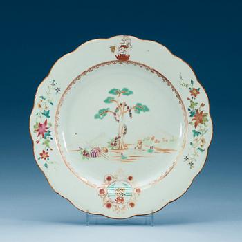1551. A famille rose armorial dinner plate, Qing dynasty, Qianlong (1736-95).