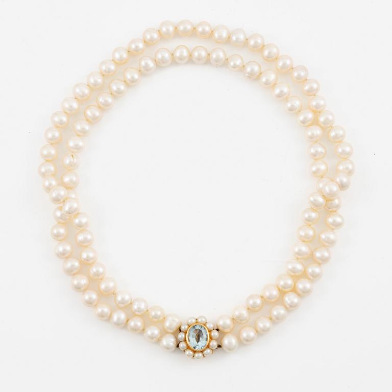 A two strand cultured freshwater pearls necklace, clasp 18K gold with an aquamarine.