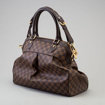 a LOUIS VUITTON 'Trevi GM' bag.