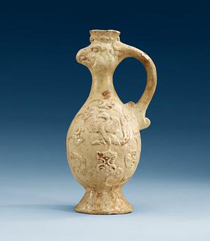 A cream-glazed pottery Phoenix-head ewer, Tang dynasty (618-907 AD).