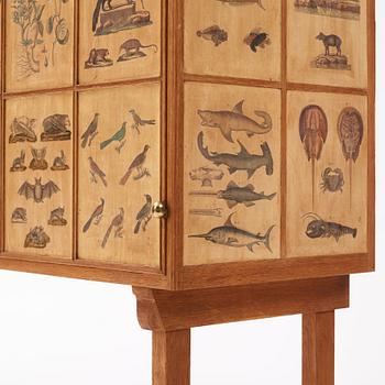 Josef Frank, a rare cabinet covered with prints depicting different animals and plants, Firma Svenskt Tenn, Sweden 1940s.