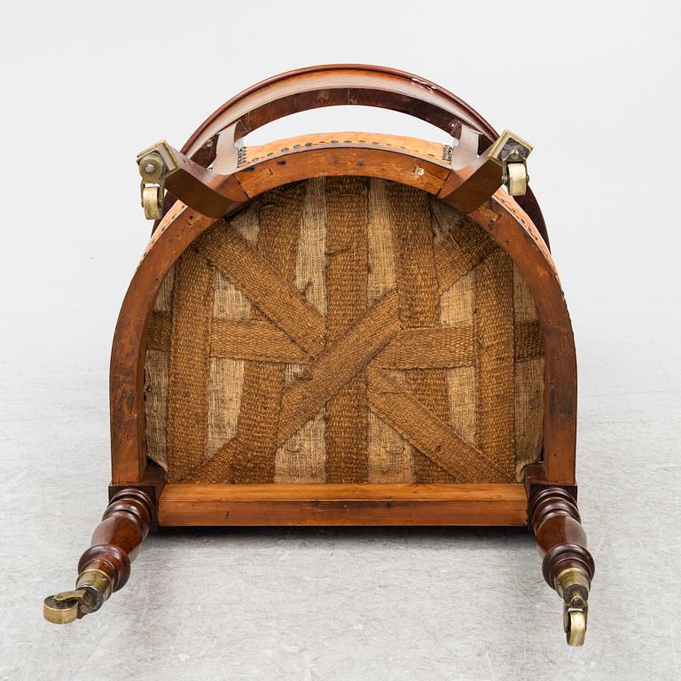 An Empire armchair, 19th century.