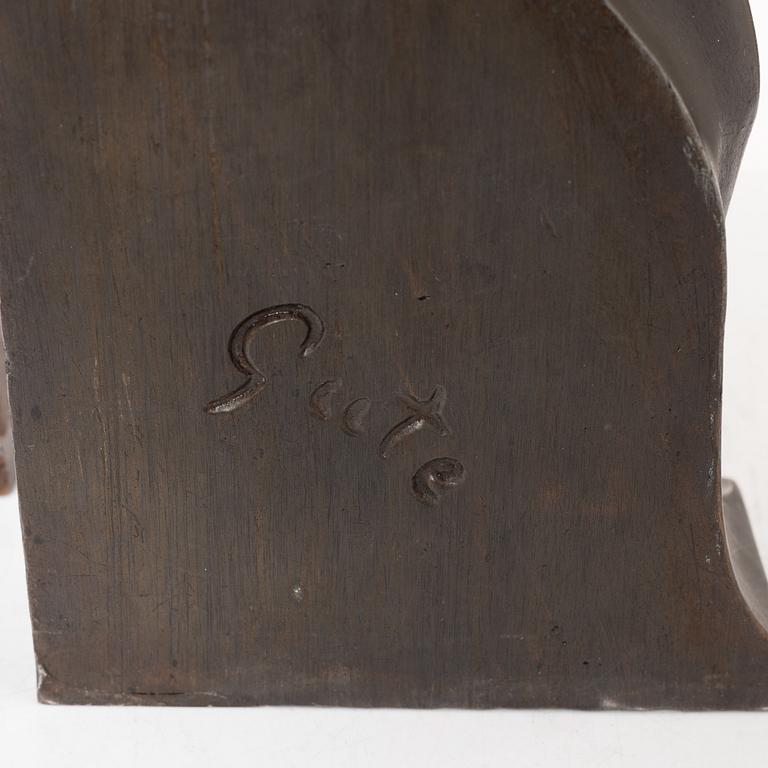 Axel Gute, two patinated metal bookends.