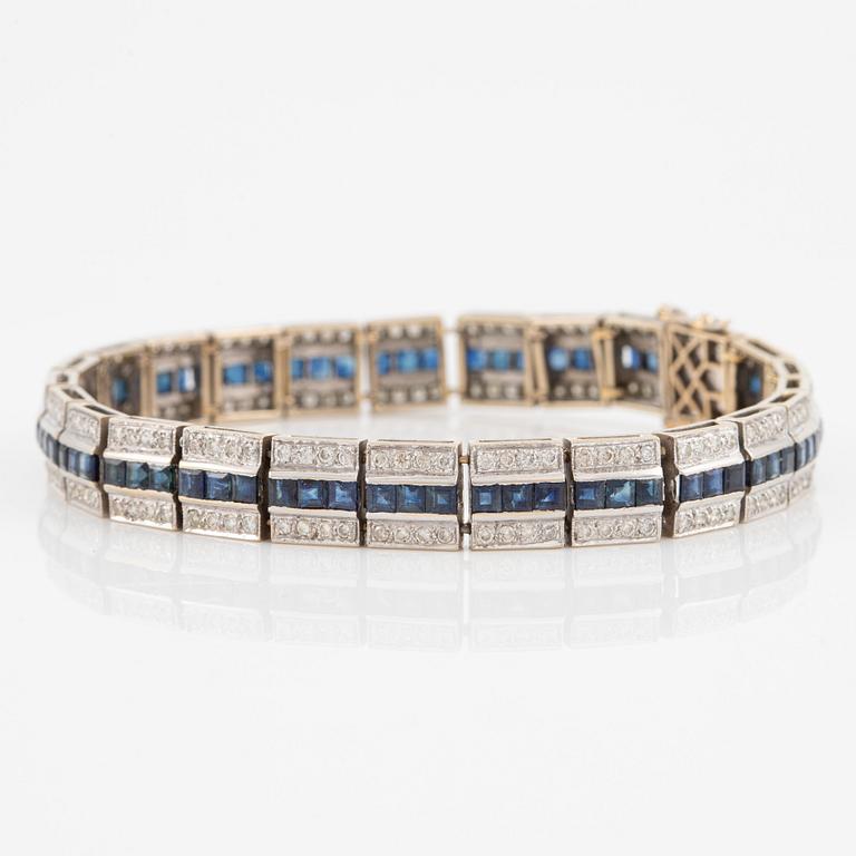 Bracelet 18K gold with round brilliant-cut diamonds and step-cut sapphires.