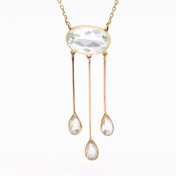 An 18K and 14K gold necklace with aquamarines.