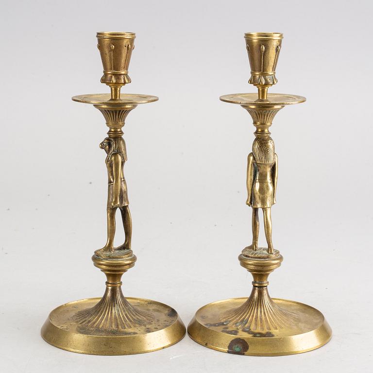 A pair of early 20th century brass candle sticks.