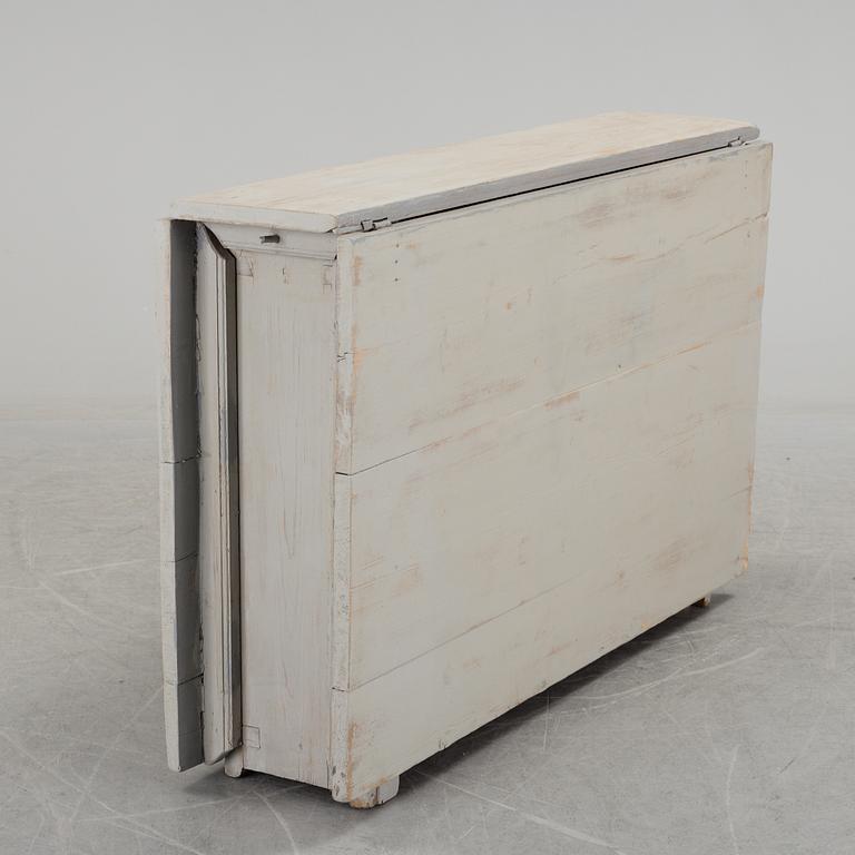 a gate-legged table from the 19th century.