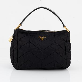 Prada, a black nylon bag.