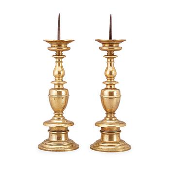 1618. A pair of Baroque 16/17th century brass pricket candlesticks.