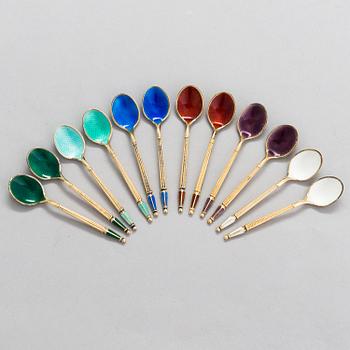 A set of 12 espresso spoons in gilt sterling silver and enamel, mark of A. Michelsen, Denmark.