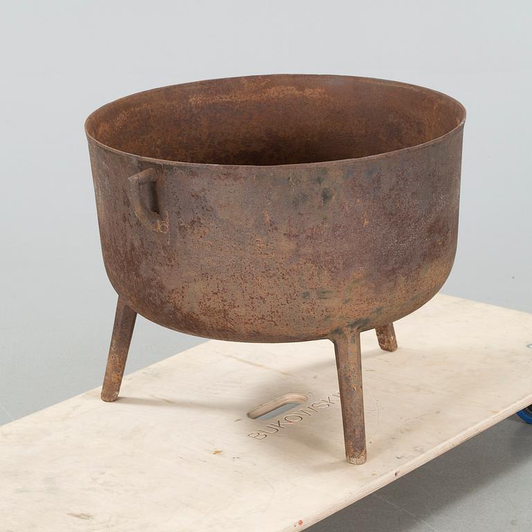 A 19th century iron pot.