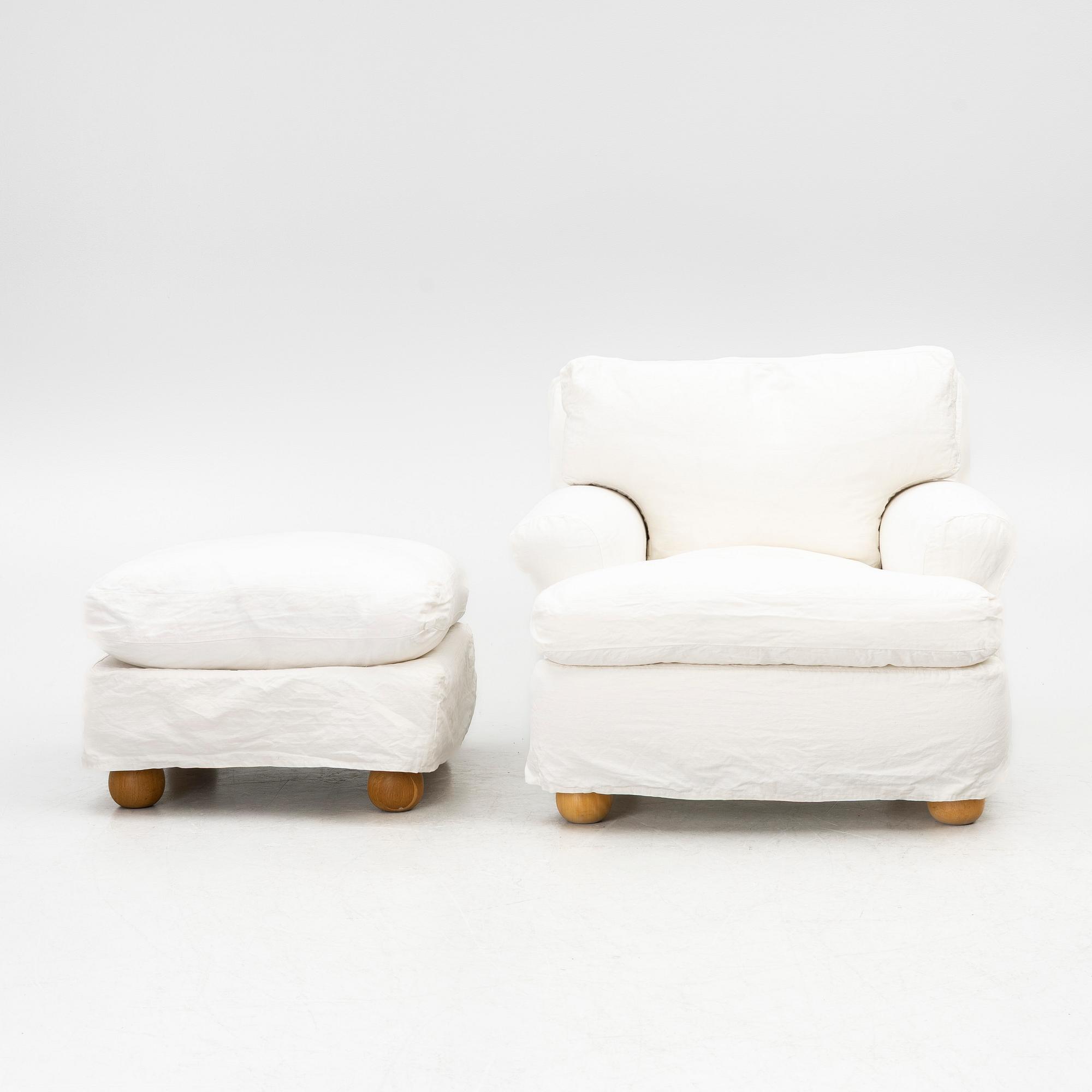 An armchair with ottoman, contemporary.