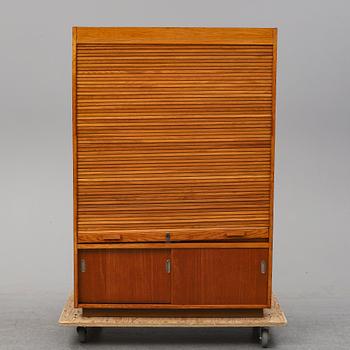 A oak cabinet from the first half of the 20th century.