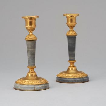 A pair of Louis XVI-style 19th century Henri Picard candlesticks.