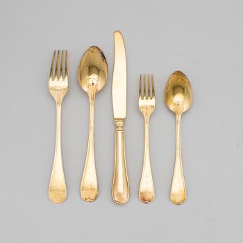 A set of 60 pieces of cutlery gilded sterling silver by CG Hallberg in Stockholm 1957-1961. Total weight c. 3950 gram.