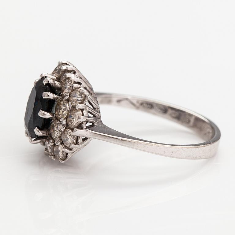 A 14K white gold ring with a sapphire ca. 1.24 ct and diamonds ca 1.25 ct in total. Finnsh import marks 1994.
