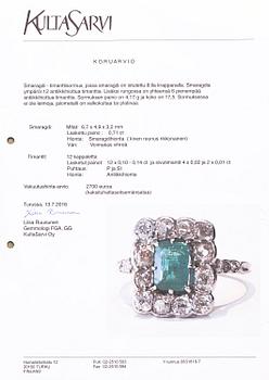 A platinum ring with an emerald ca 0.71 ct and old cut diamonds ca 1.66 ct in total.
