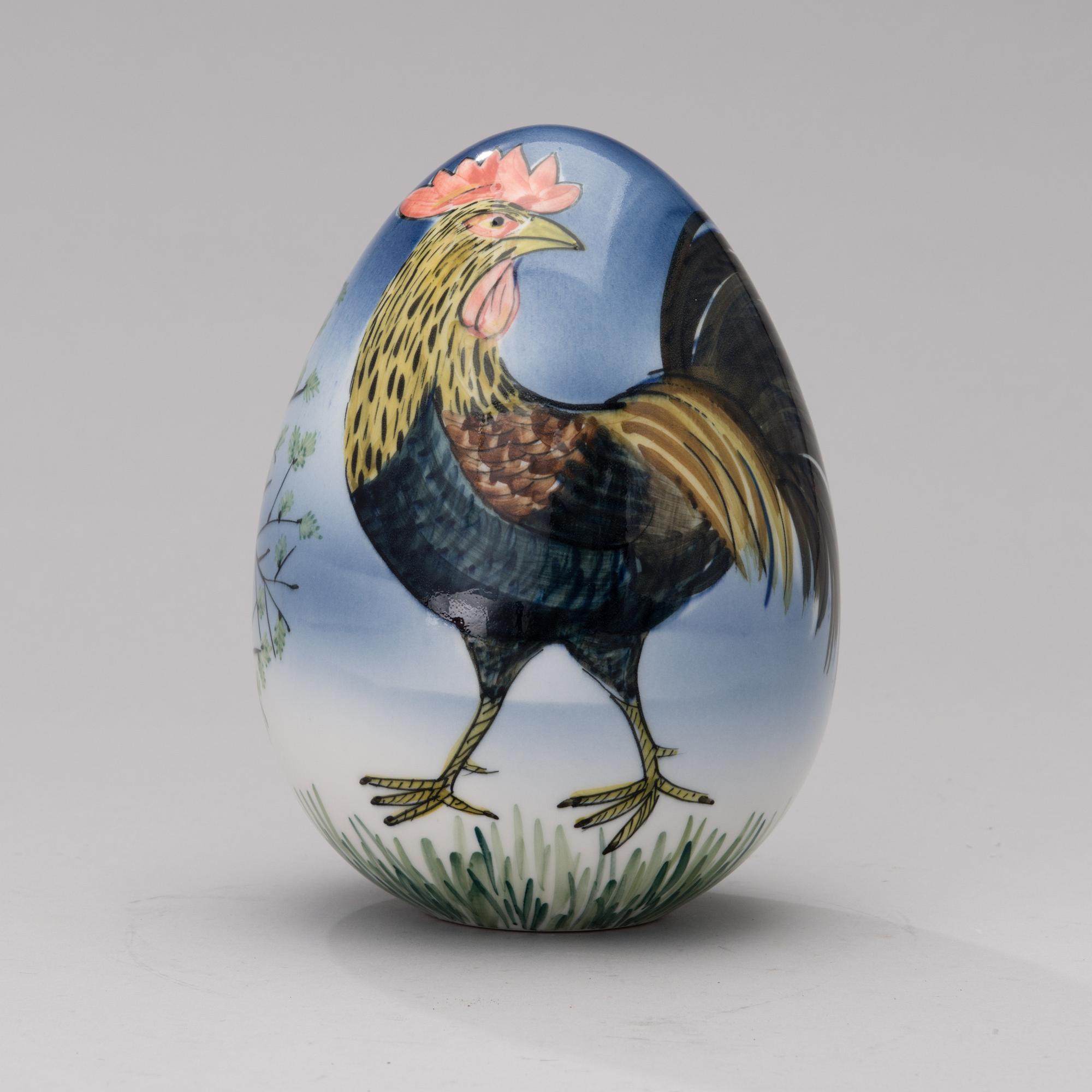 A porcelain egg signed GOG Arabia Finland.