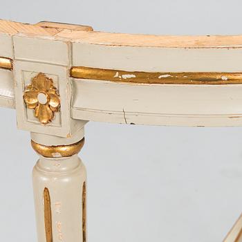 A Gustavian style sofa and table from early 20th century.