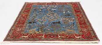 A Quum rug, figural, c. 210 x 142 cm.