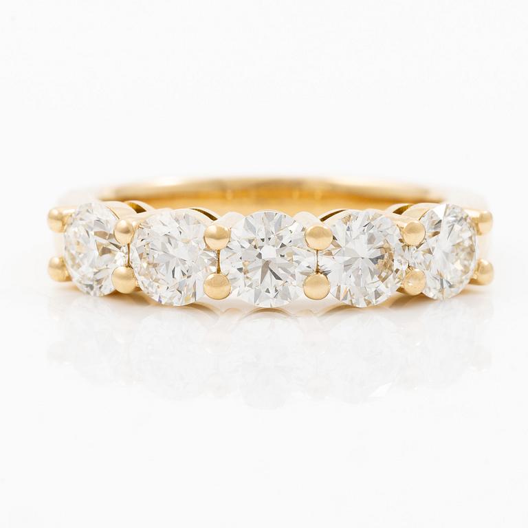 Half eternity ring in 18K gold set with brilliant-cut diamonds.