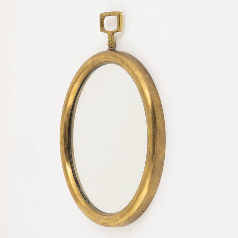 Josef Frank, or Estrid Ericson, a brass mirror, model "H2672", Firma Svenskt Tenn, Sweden 1950s-60s.