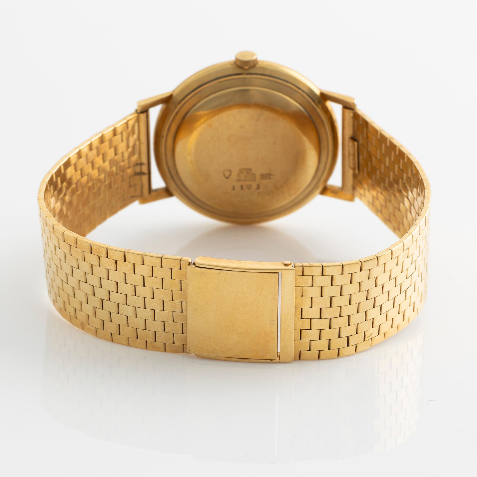 Deco, 18k wristwatch with bracelet in 18K gold, 34 mm.
