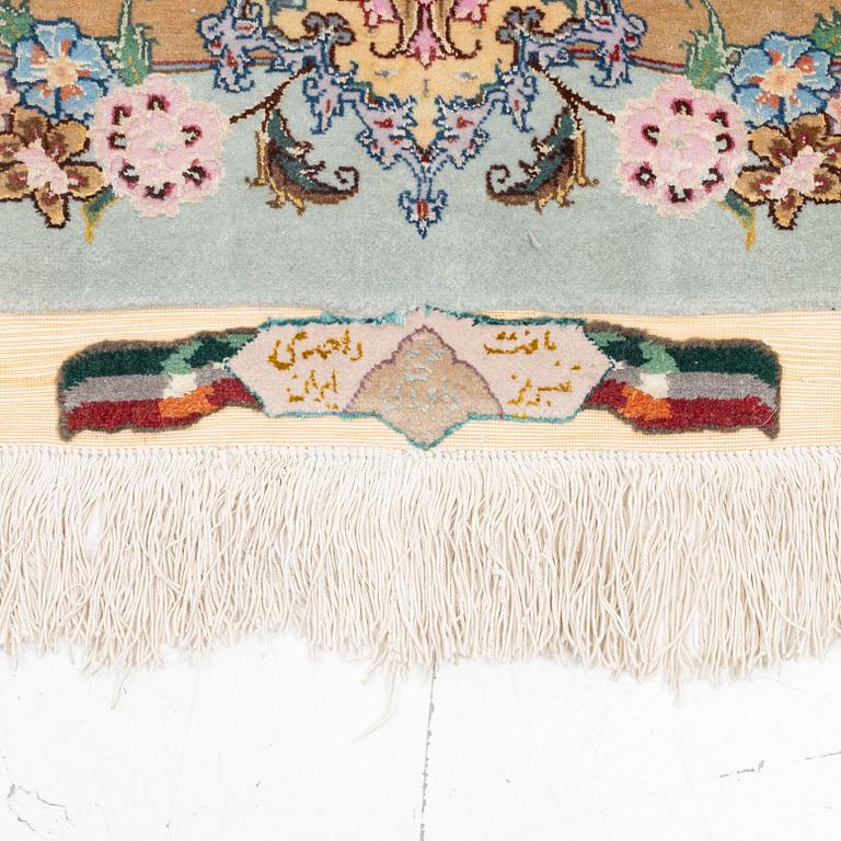 A Tabriz carpet, part silk, approx. 367 x 250 cm.