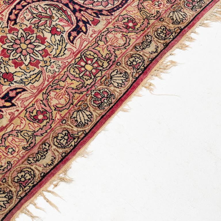 An antique Kerman Laver carpet, south east persia, ca 501 x 359 cm.