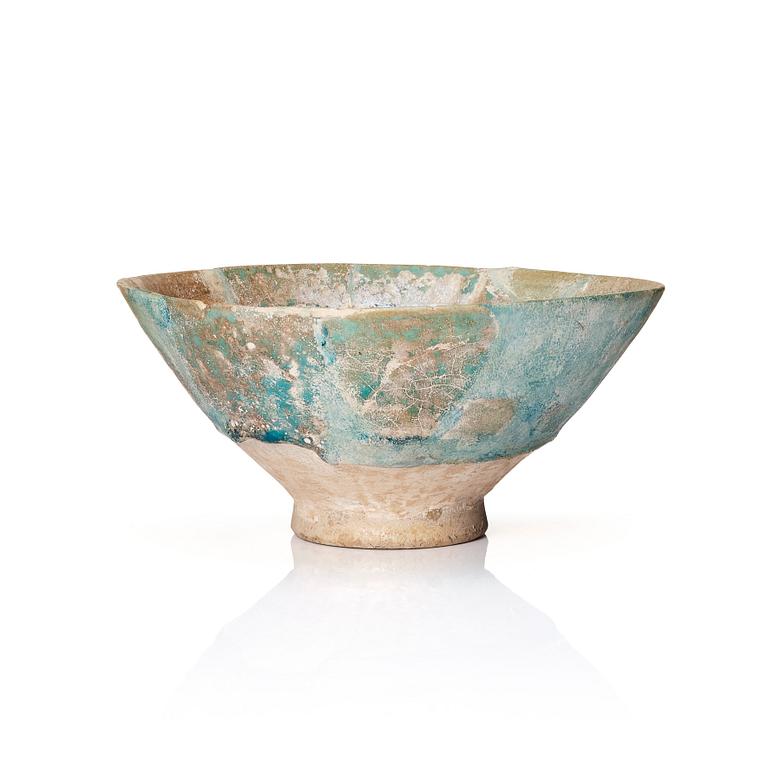A 10-11th century Kashan Turquoise-glazed pottery bowl.