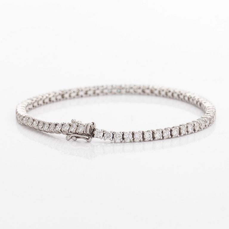 Tennisrannekoru, 18K valkokultaa, briljanttihiontaisia timantteja yhteensä noin 3.84 ct kaiverruksen mukaan.