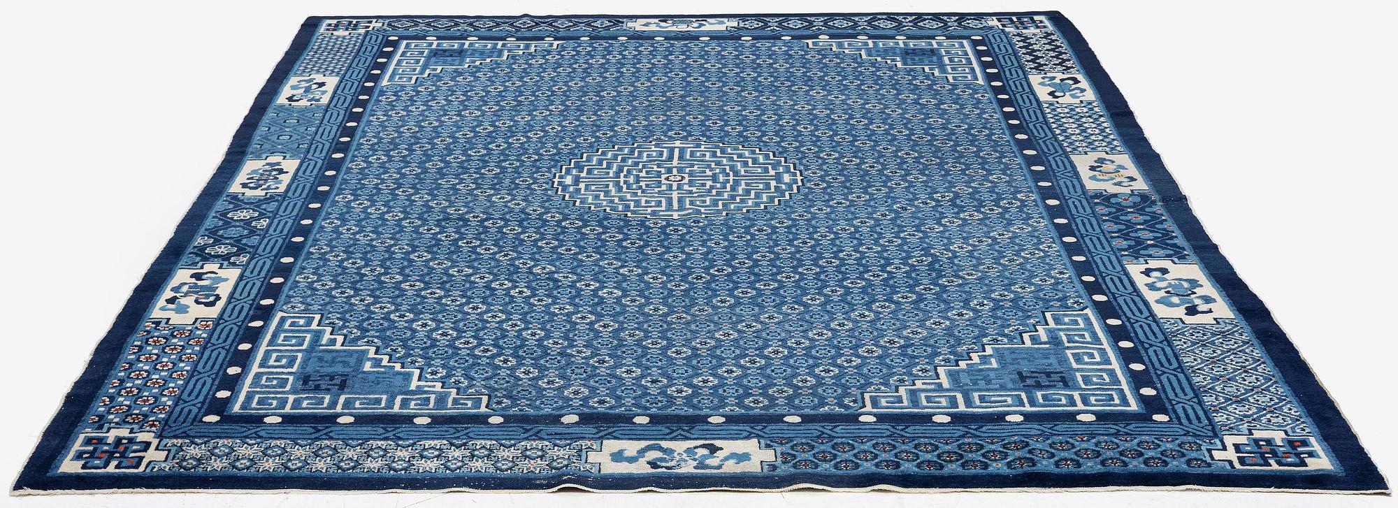 A semi-antique Baotou carpet, West China, c. 335 x 246 cm.