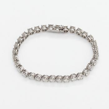 Tennisrannekoru, 18K valkokultaa ja briljanttihiottuja timantteja n. 7.50 ct yht.