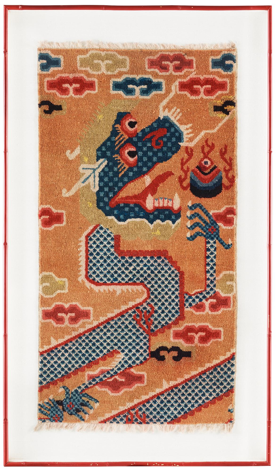 PILLAR RUG, FRAGMENT. Framed. Semi-antique China. 123 x 66 cm (with the frame 151 x 87,5 cm).