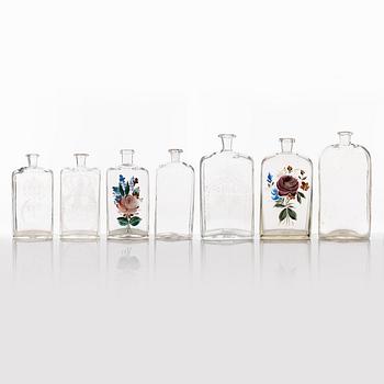 A set of seven glass bottles, 19th Century/circa 1900.