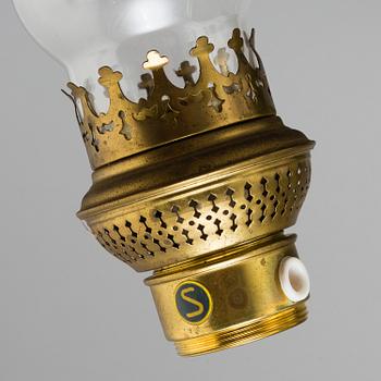 a paraffin ceiling light, brass and glass.