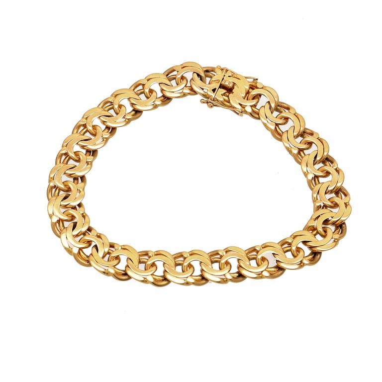 An 18K gold Bismarck bracelet.