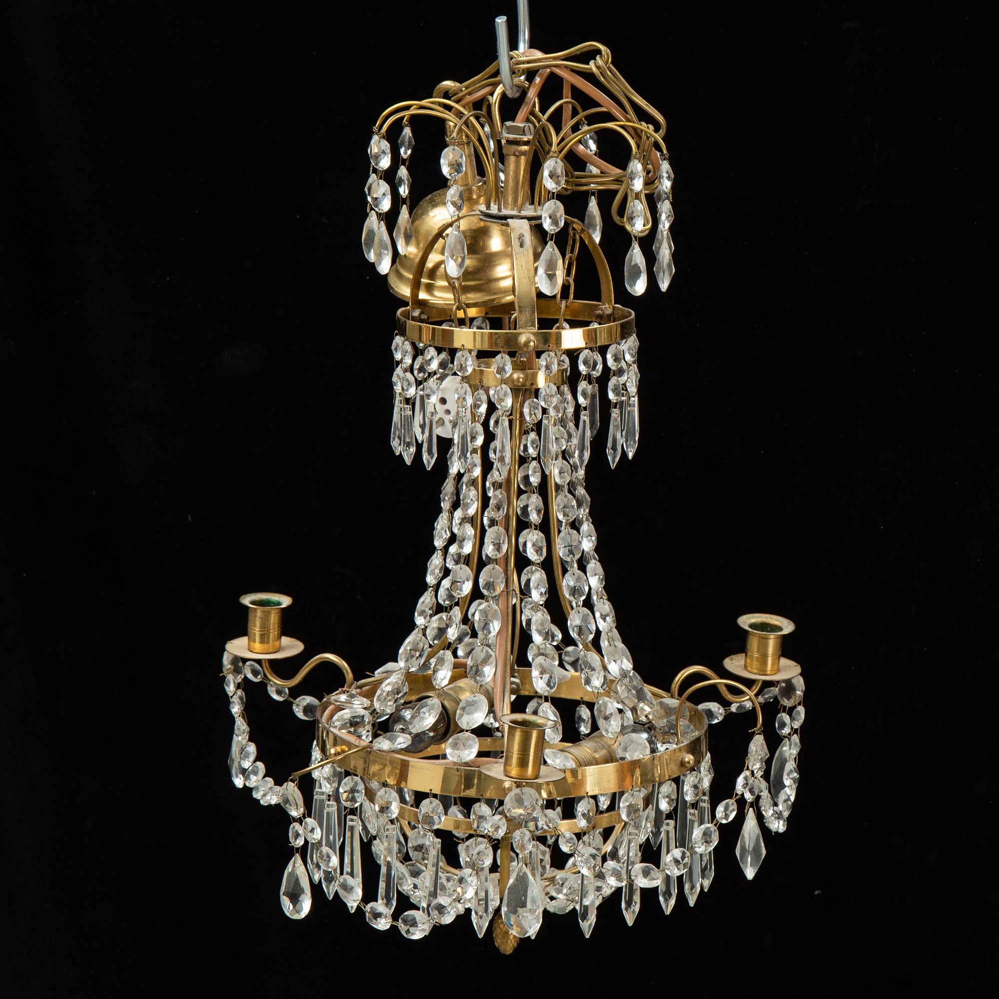 A small Swedish 20th century empire style chandelier for three candles.
