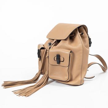 Gucci, a backpack.
