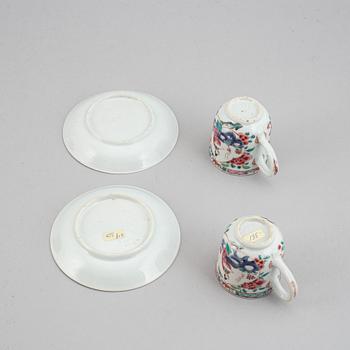 A pair of famille rose cups with dishes, Qing dynasty, Yongzheng (1723-35).