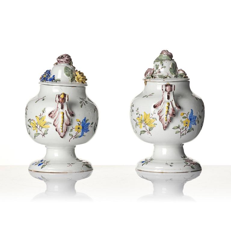 A pair of fainece potpurri jars with covers, Northern Europe, 18th century.