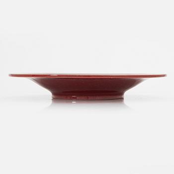 Wilhelm Kåge, a red glazed stoneware 'Argenta' dish, Gustavsberg, Sweden 1956.