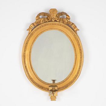 A Gustavian giltwood one-branch girandole mirror, Stockholm, late 18th century.