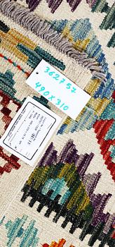 A Kilim carpet, c. 490 x 310 cm.