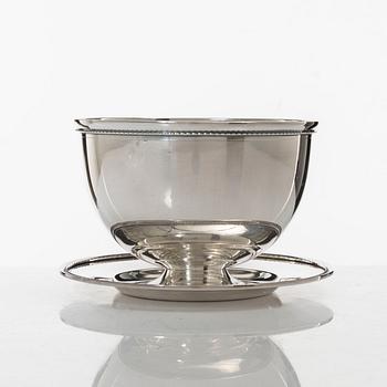 A Swedish silver Sweetmeat/sauce bowl on a plate, mark of company Guldsmedsaktiebolaget, Stockholm 1962.