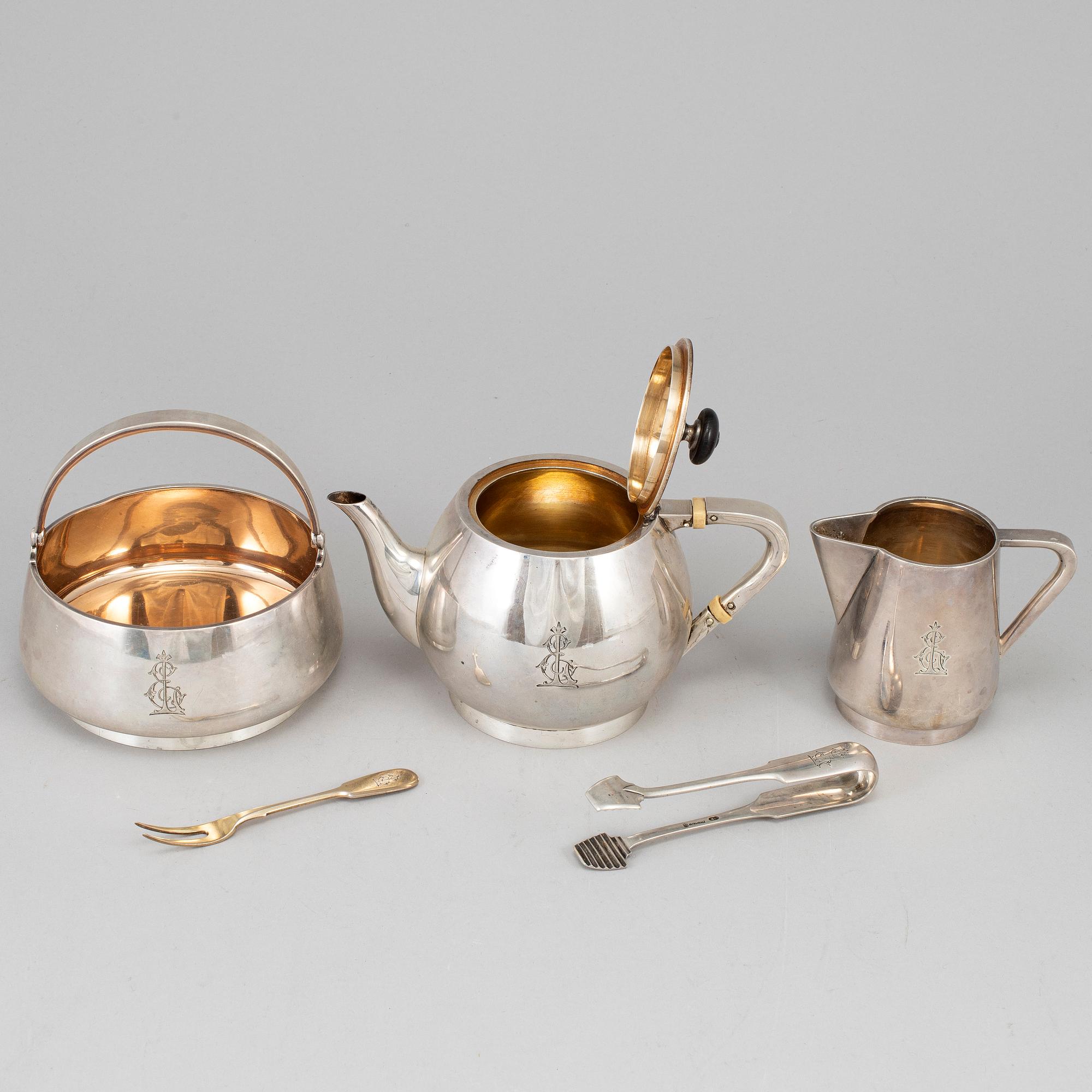 A Russian early 20th century parcel-gilt silver 5 piece tea-set, mark of Grachev, St. Petersburg 1908-1917.