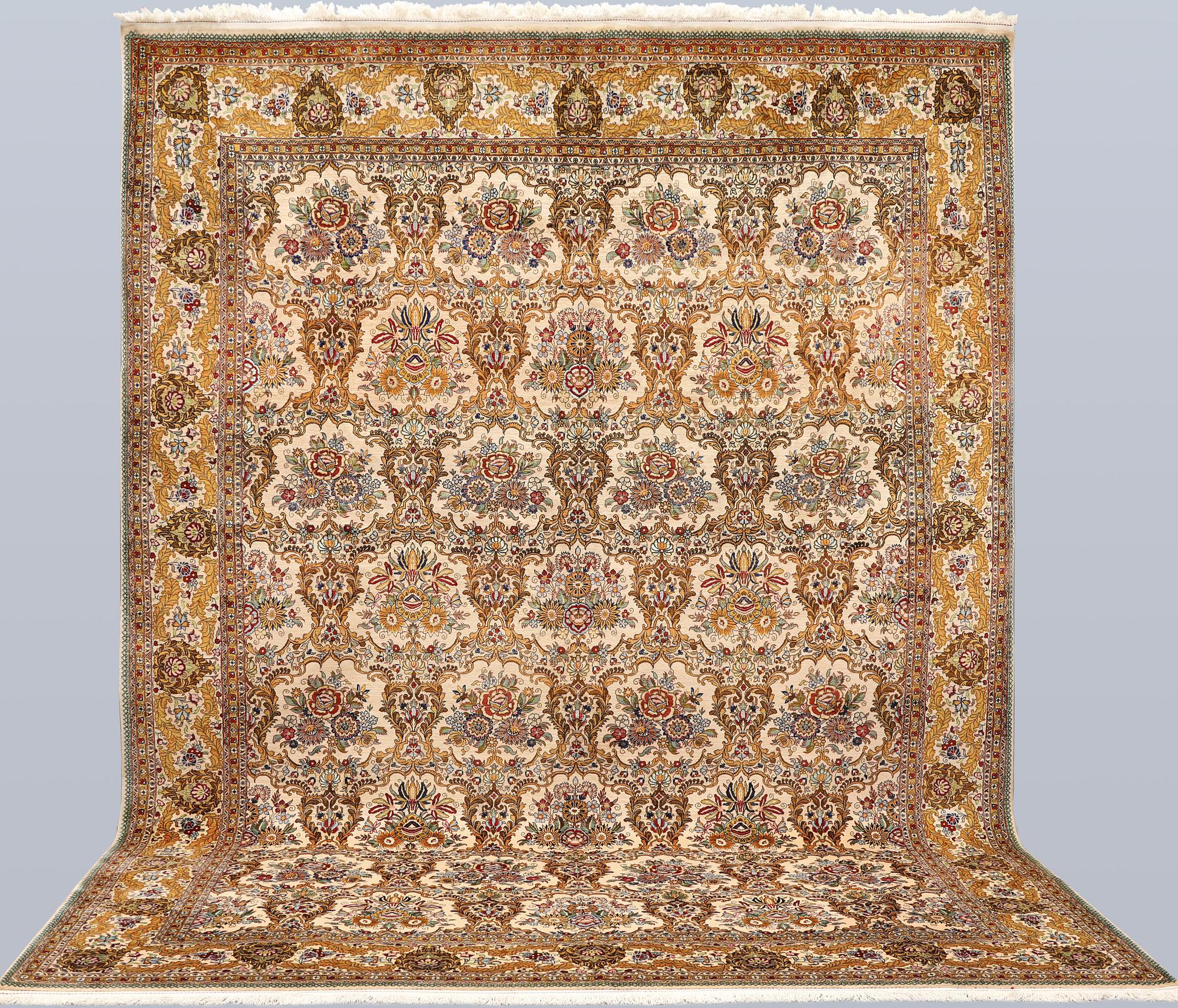 A part silk Ghom carpet, c. 420 x 310 cm.