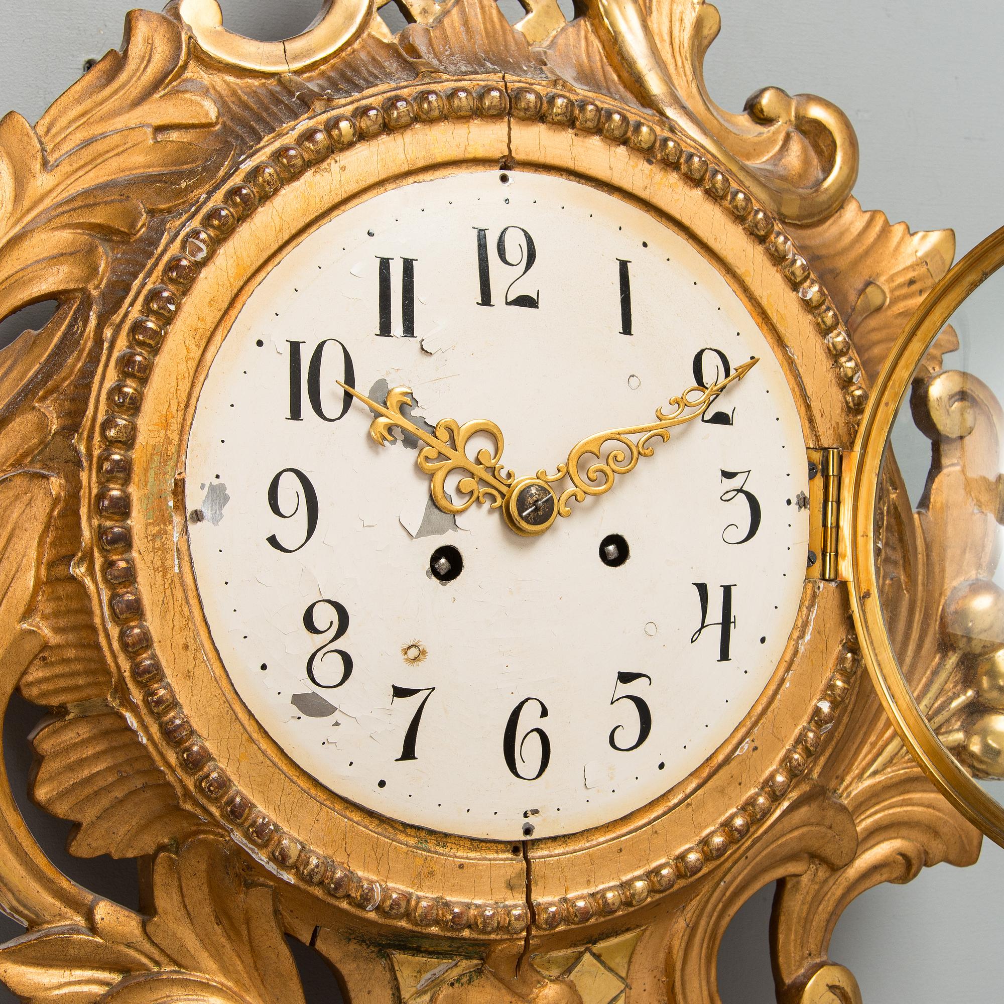 A Rococo style wall clock from first half of the 20th century.