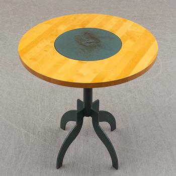 A round "triptyk II" table by Jonas Bohlin for Källemo.